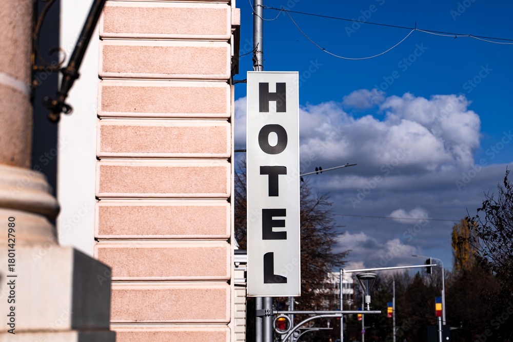 Obraz premium Close-up of a hotel sign in Bârlad, showing the name and exterior branding of the building, captured in daylight.