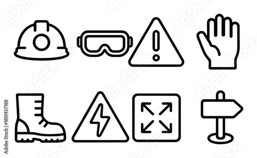 Safety equipment and warning symbols in industrial setting