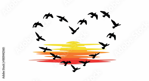 Birds flying in heart shape over sunset