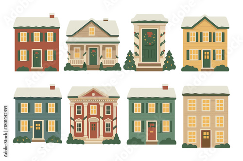 Festive painted houses with snowy roofs decorated for christmas