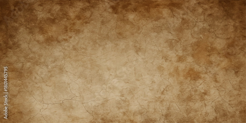 Grungy brown vintage texture of an aged antique paper sheet or stained parchment wall background