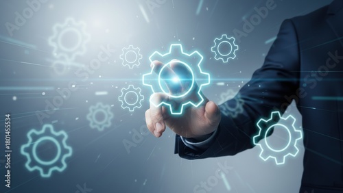 Wallpaper Mural A hand reaches toward a bright cyan gear hologram with drifting neon wheels in cool silver light digital copyright or patent Torontodigital.ca