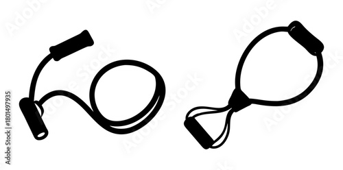 Two types of resistance bands for exercise, including a loop band and a band with handles, isolated on