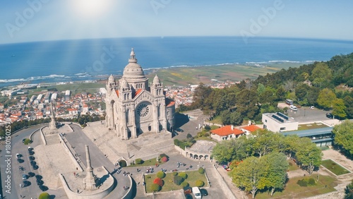 Top aerial view Sanctuary of Santa Luzia in Viana do Castelo Portugal building monument temple church flying drone blue sky sun shining pilgrim concept old city travel trip traveling Atlantic Ocean