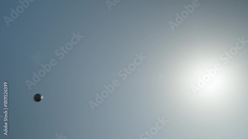 Flight of a shot shot against the background of the sky by an abandoned professional athlete