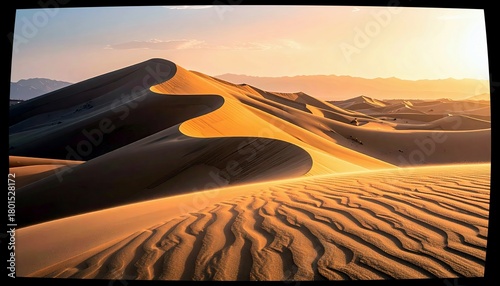 Fototapeta Naklejka Na Ścianę i Meble -  Expansive desert landscape with dramatic sand dunes sculpted by wind, illuminated by the warm glow of sunset.