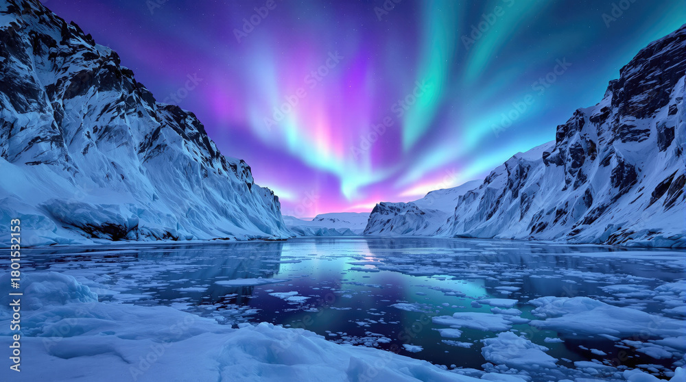 Naklejka premium Vibrant Aurora Borealis over Icy Mountains and Frozen Water