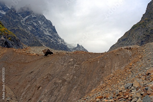 Chalaadi Glacier, ice, glacial flour, moraine, and snow in the Caucasus Mountains. Mestia, Svaneti, Georgia.