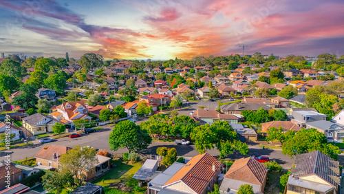 Aerial Panorama Drone View of a inner western Sydney Suburb of Ashbury Urban Sprawl and the terracotta roof tops streets and trees of Suburban Sydney  NSW Australia