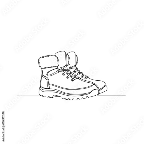 Pair of fur-lined winter boots in one line minimalist style