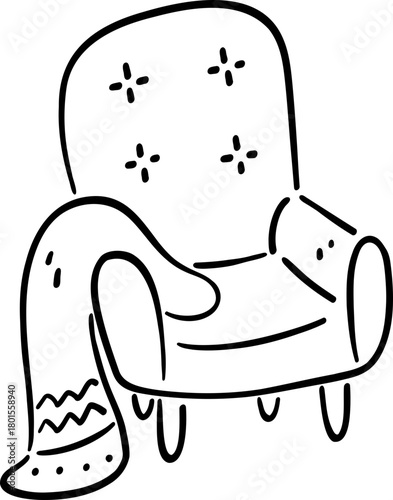 Cozy armchair with decorative blanket draped over it, perfect for relaxation