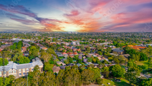 Aerial Panorama Drone View of a inner western Sydney Suburb of Ashbury Urban Sprawl and the terracotta roof tops streets and trees of Suburban Sydney  NSW Australia