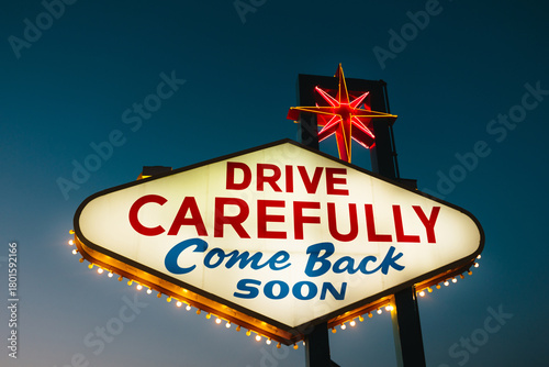 Neon sign in Las Vegas highlighting travel caution