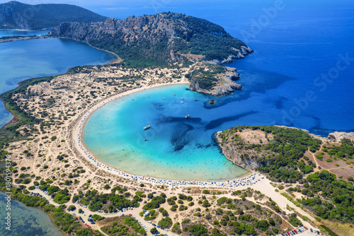 Fototapeta Naklejka Na Ścianę i Meble -  Aerial view of the half circle shaped Voidokilia beach in Messinia, Peloponnese, Greece, with sand dunes and turquoise sea