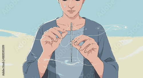 A focused young man carefully holding a thin transparent object.
