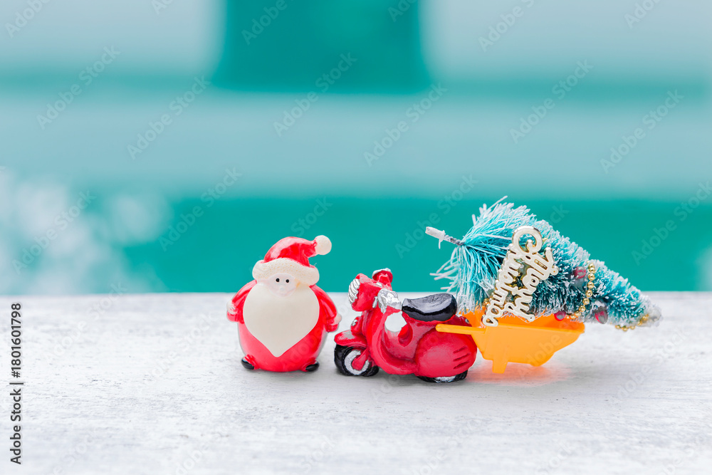 Fototapeta premium Santa with red scooter and Christmas tree over blurred background, Christmas card background idea