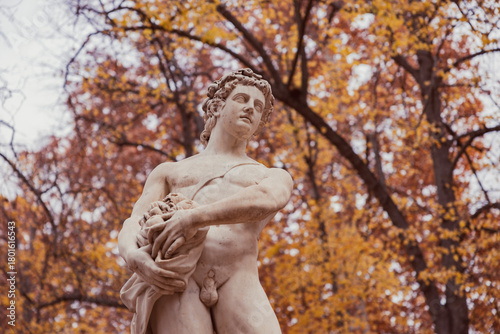 Autumnal statue in a classic garden