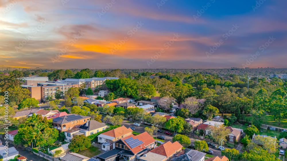 Naklejka premium Aerial Panorama Drone View of a inner western Sydney Suburb of Ashbury Urban Sprawl and the terracotta roof tops streets and trees of Suburban Sydney NSW Australia
