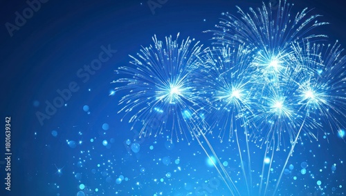 Vibrant blue fireworks exploding against a dark sky with sparkling bokeh lights, perfect for festive celebrations and holiday designs