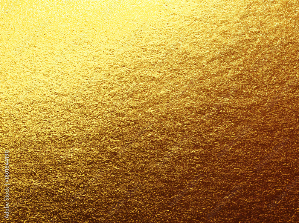 Naklejka premium A textured gold surface with subtle organic ripples and highlights across the frame.