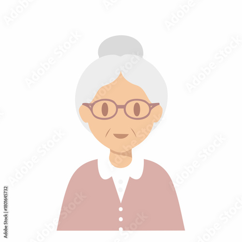 Friendly elder woman with glasses and grey hair in a bun wearing a pink cardigan