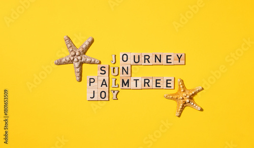 Wooden block crossword puzzle with summer theme