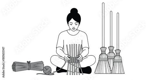 Woman crafting traditional brooms with straw for sustainable living