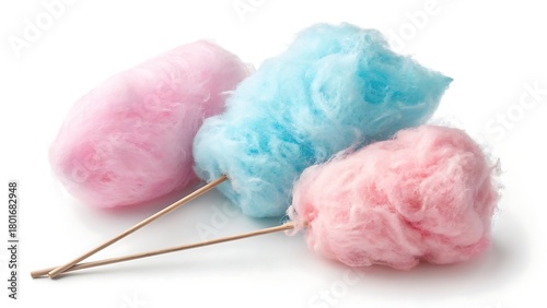 Soft and airy cotton candy displayed on a crisp white background, highlighting its light pastel spun sugar texture.