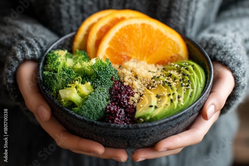 Healthy Bowl Filled With Broccoli, Avocado, Orange Slices, and Quinoa Served ...