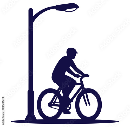 Silhouette of a cyclist riding a bicycle past a street lamp in a vector illustration