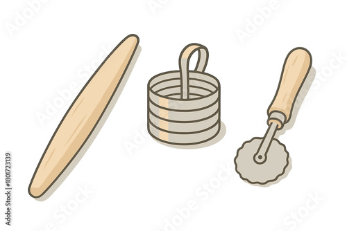 Assortment of traditional pasta making tools including rolling pin and pastry cutter