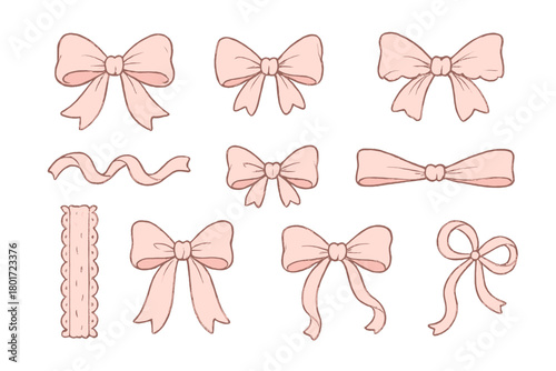 Assortment of pink satin ribbon bows and decorative crafting elements