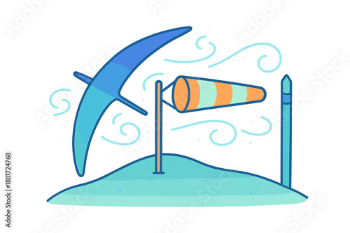Hang glider and windsock on small hill indicating air movement