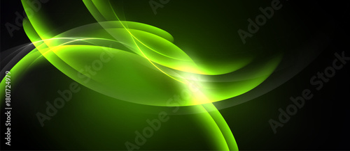 Abstract green light streaks form flowing shapes. Bright center radiates energy, dark background emphasizes luminosity. Smooth curves suggest movement.