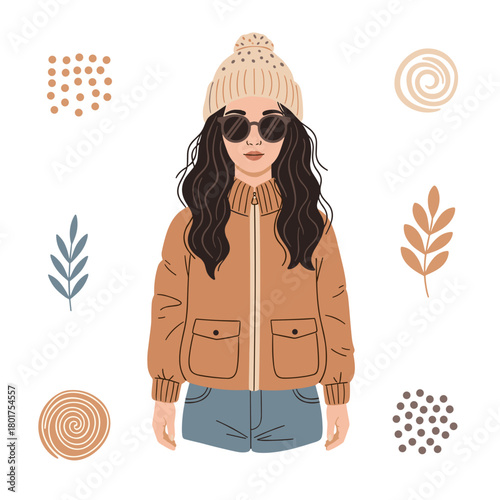 Young woman wearing a warm jacket and hat with sunglasses in autumn  