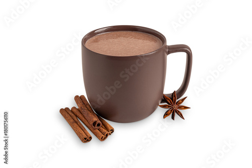 Cozy hot chocolate or homemade sweet cocoa drink with dried cinnamon sticks and star anise spices served in dark brown cup isolated on white background for comfortable breakfast as festive dessert