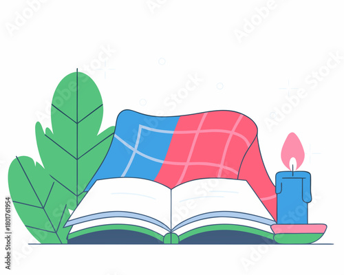 Cozy book reading setup with candle and blanket