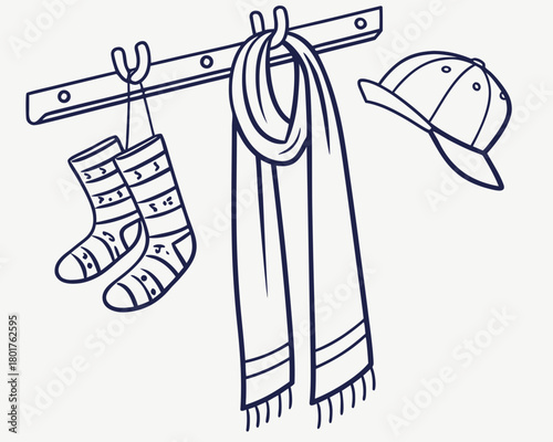 Socks, scarf, and baseball cap hanging on a coat rack