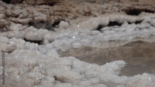 Close-up of salt crystals and small pool of water in Chott el Djerid, the largest (mostly dried up) salt pan in the Sahara, natural scenery in Tunisia