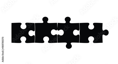 Four puzzle pieces connected representing teamwork