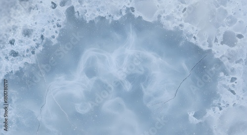Frozen Beauty: An ethereal aerial view reveals a mesmerizing expanse of frozen water, a landscape of abstract patterns, capturing nature's icy artistry.