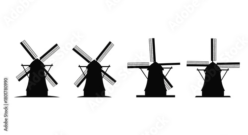 Four black windmill silhouettes in a row