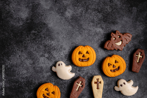 Halloween cookies on dark textured background