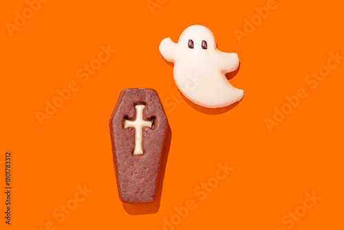 Halloween cookies on bright orange background