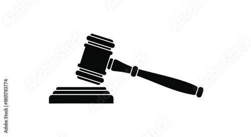 Black silhouette of a judge s gavel resting on its sounding block against a white background