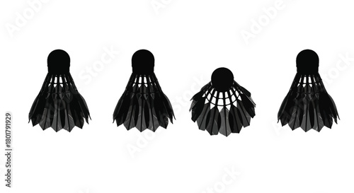 Four black badminton shuttlecocks in a row