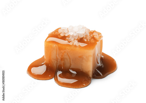 Foto Tasty candy with salt and caramel sauce isolated on white