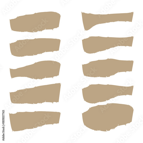 Collection of torn brown paper strips with rough edges on white background