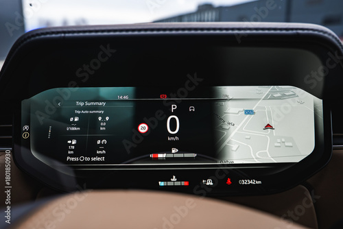 Photography Close up of a digital instrument cluster shows 0 kmh in Park, trip data, and a 3