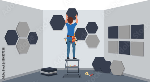 Dedicated craftsman expertly installs hexagonal acoustic panels, transforming studio space with modern soundproofing solutions